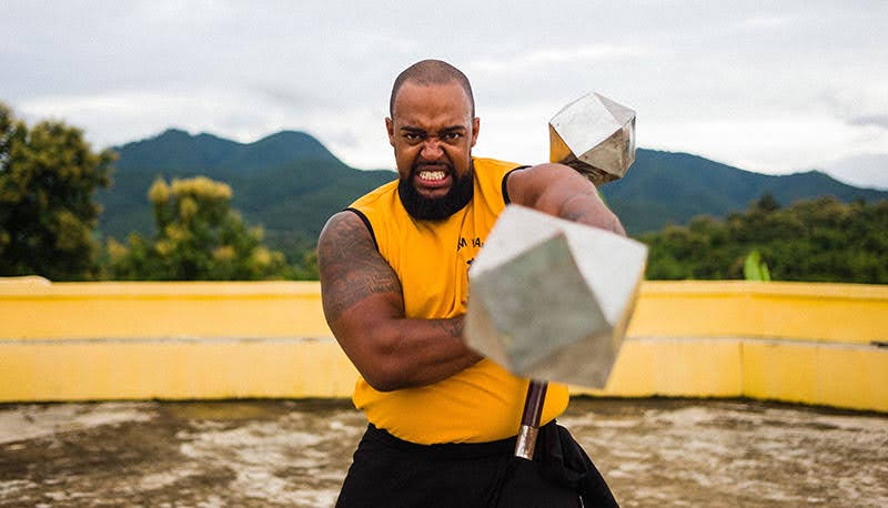 Instructor AJ striking with the Thunder Hammers