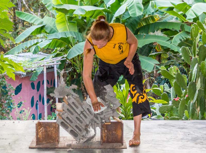 Marion breaking 5 concrete blocks.