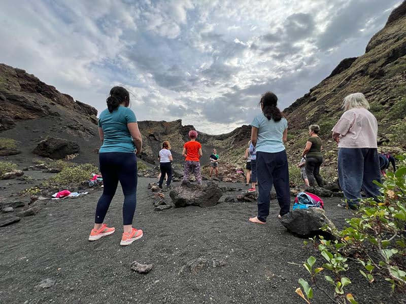 Lauras class practicing qigong in a volcanic crater