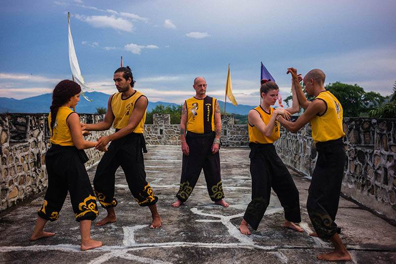 Students training pushing hands with Master Iain's guidance