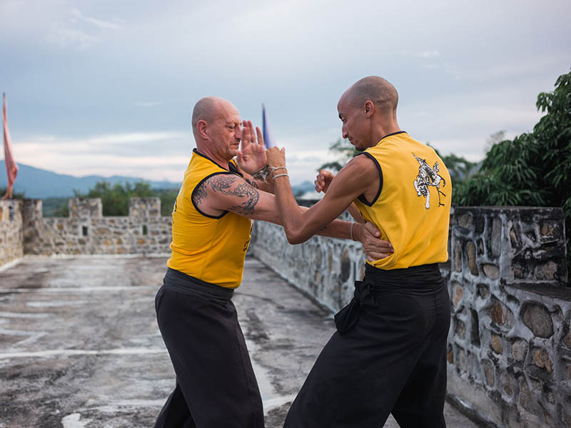 Instructor Lefa drilling sticky hands with Master Iain